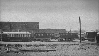 T.T.C., #2208, (scraper car, at left), at Eglinton carhouse, also showing sweepers S-22 (centre) & S-21 (right centre). Toronto, Ontario