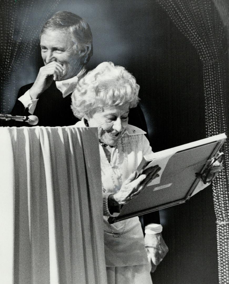 There's no business..: Sharing a joke, Dora Awards show emcee Don Harron looks on as Jane Mallett expresses her appreciation for $1,000 Brenda Donohue Award