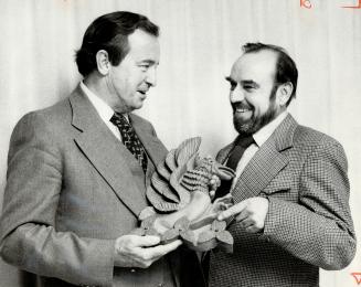 A hand-carved Griffin was made by Bill Johnson (right), president of the Nassagaweya Area Ratepayers' Association, and presented to Ombudsman Arthur M(...)