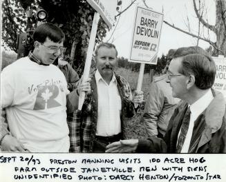 Preston Manning visits 100 acre hog farm outside Janetville