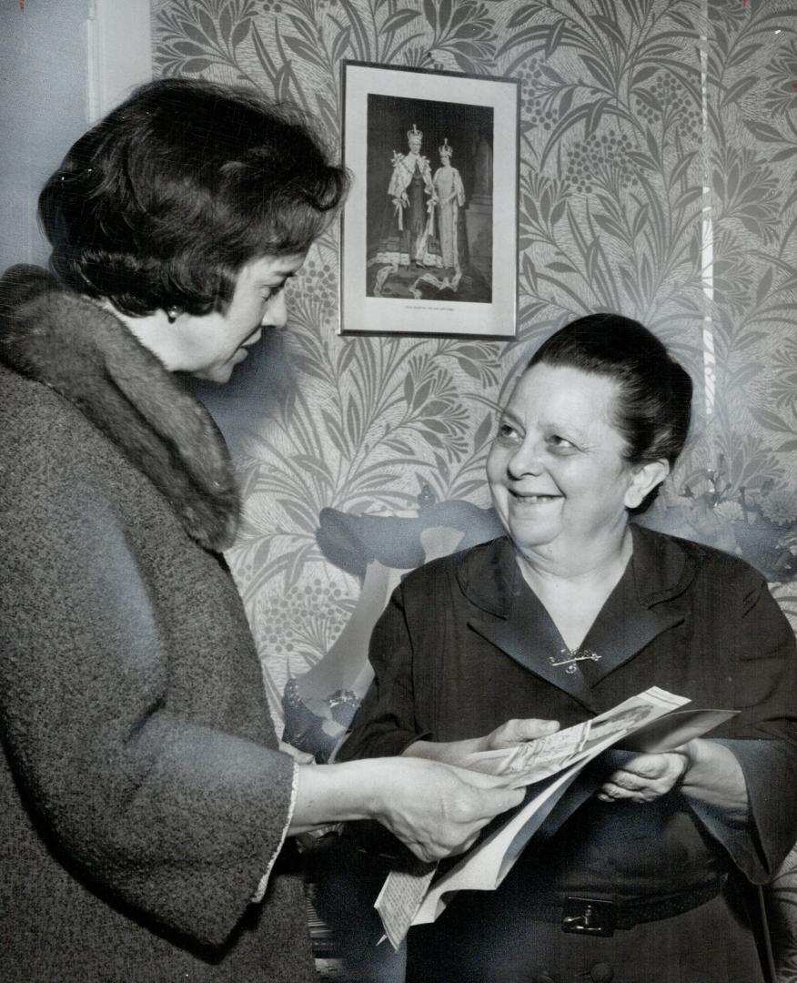 June Marks (left) with Mrs. Manning. Controller gives widow money sent anonymously