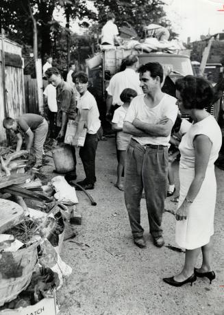 Ontario St. Lane Cleanup in progress. Alderman June Marks talks with Theodore Tourounis