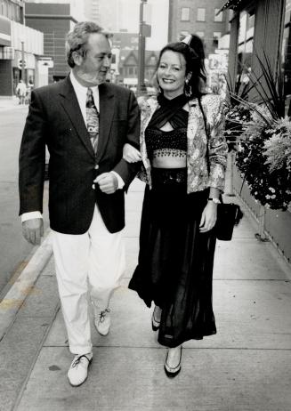 Below, William Marshall, founder of the Festival of Festivals, wears Batman tie as he arrives with real estate agent Susan Marfleet. She is in an Arab(...)