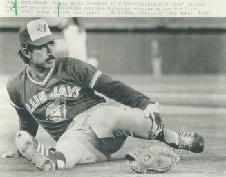 Toronto Blue Jays' catcher Buck Martinez does stretching exercies Wednesday evening before his first start after being injured last year