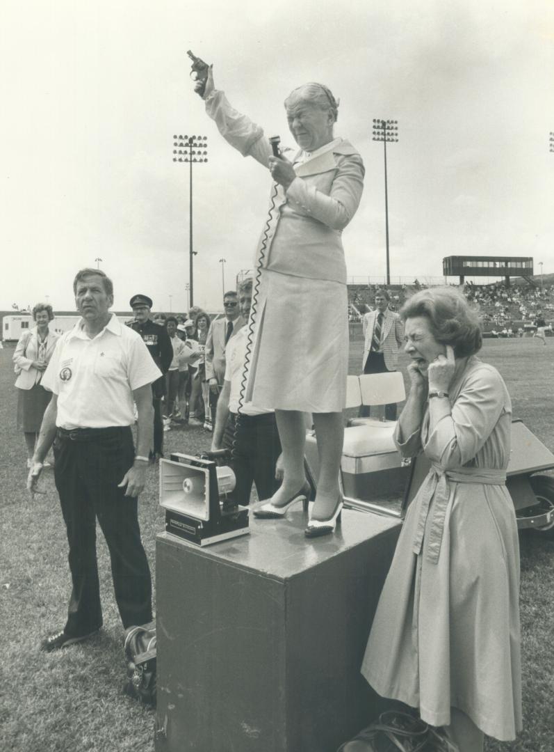 Duck! Lt.-Gov. Pauline McGibbon winced as she cracked the starter's pistol at the Colgate Ladies' track meet at Etobicoke Centennial Stadium yesterday(...)