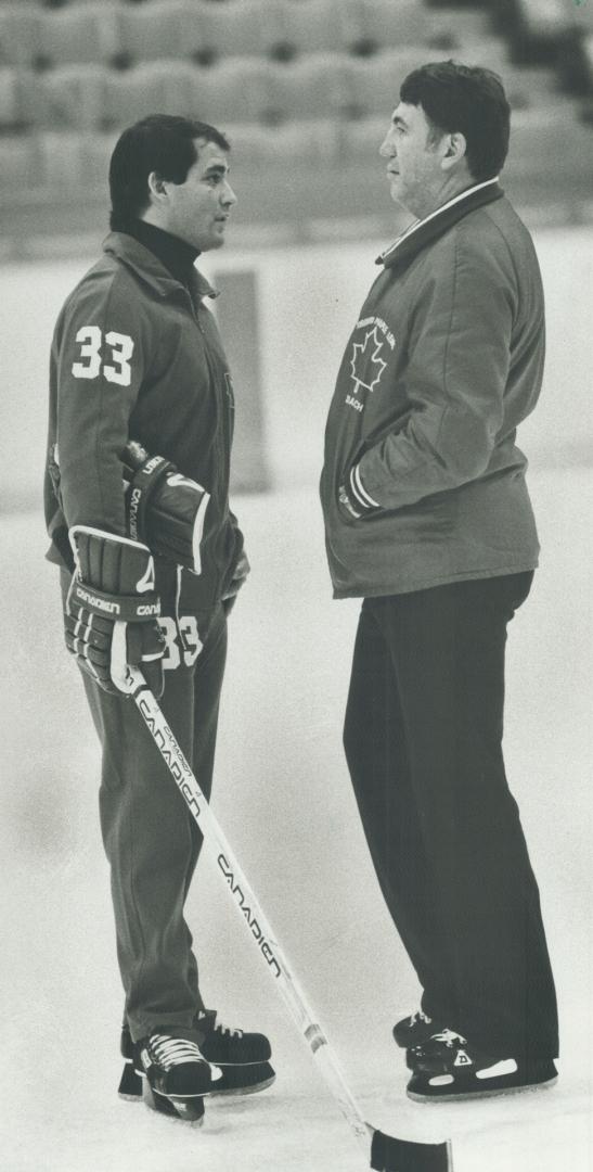 Coach corps: Leafs' leader Mike Nykoluk confers at practice with new assistant, 28-year-old Doug McKay, who coached in Italy last season and will handle Toronto defensive system