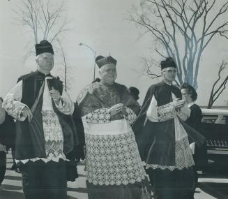 New motherhouse blessed. James Cardinal McGuigan, centre, leads procession to chapel of new convent for blessing of the Motherhouse of the Sisters of (...)