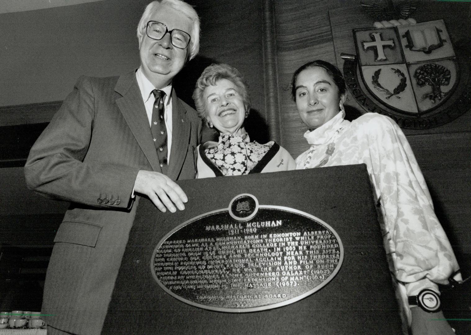 The message: At St. Michael's College yesterday are Richard Alway of U of T, Corinne, widow of Marshall McLuhan, and the historical board's Christine Caroppo Clarence