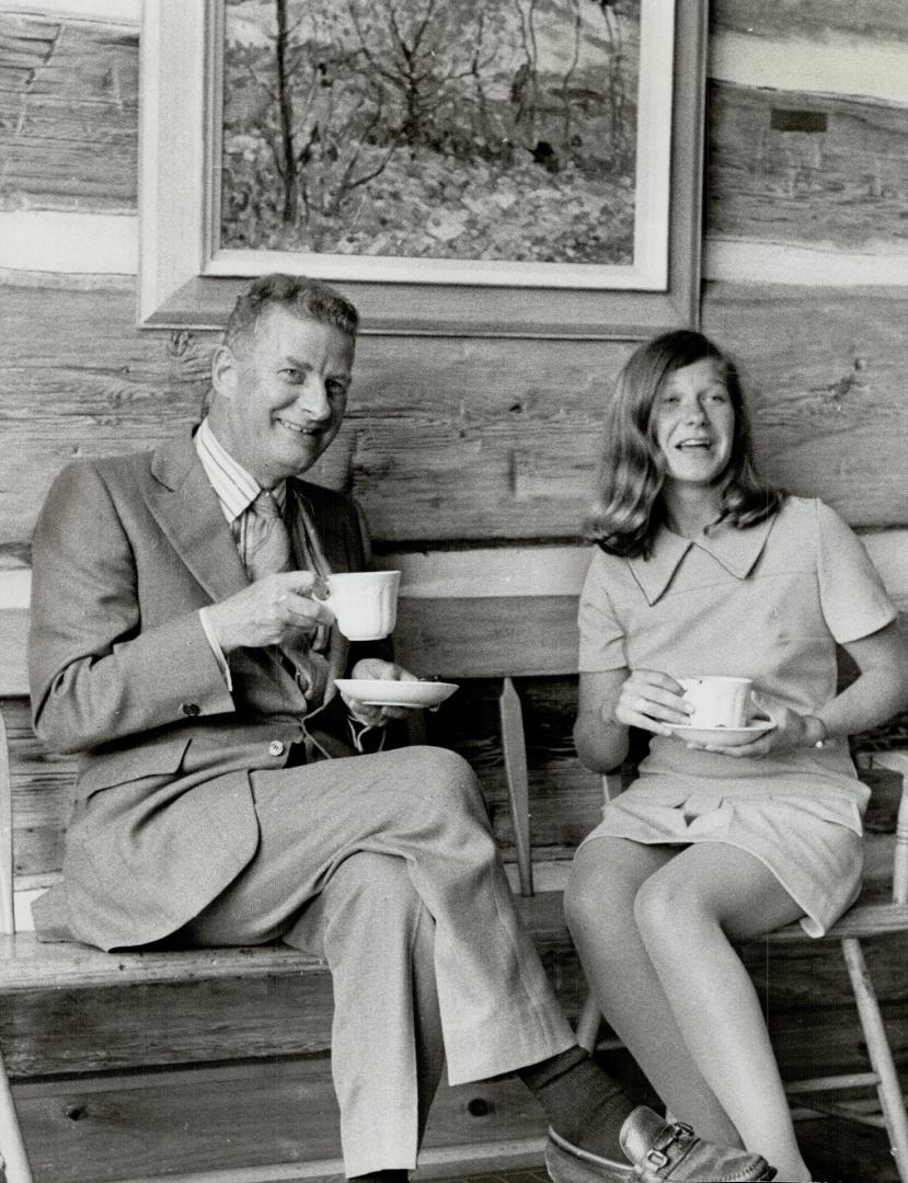 Bob McMichael enjoys a cup of coffee after dinner with Jill Trottier in the picturesque setting of the art gallery