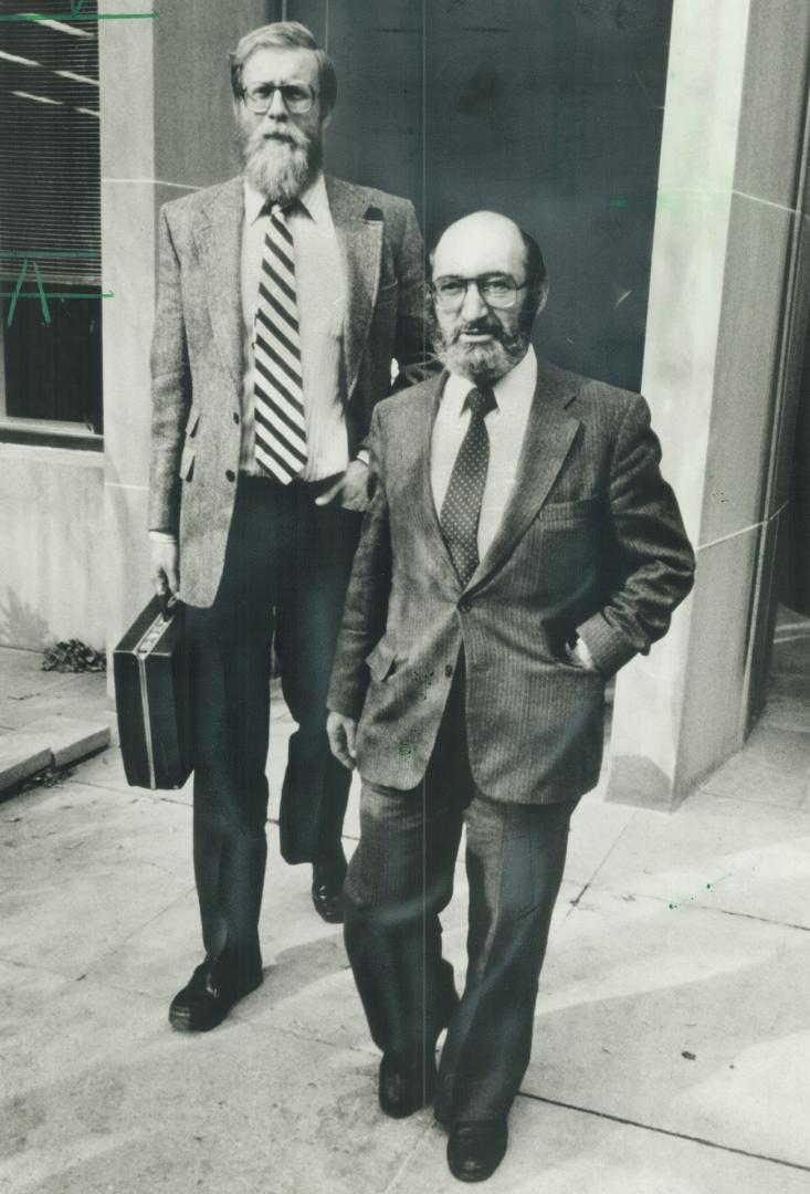 Out of court: Dr. Henry Morgentaler and Dr. Robert Scott leave the Supreme Court of Ontario yesterday where charges against Scot and Dr. Leslie Smoling were dropped