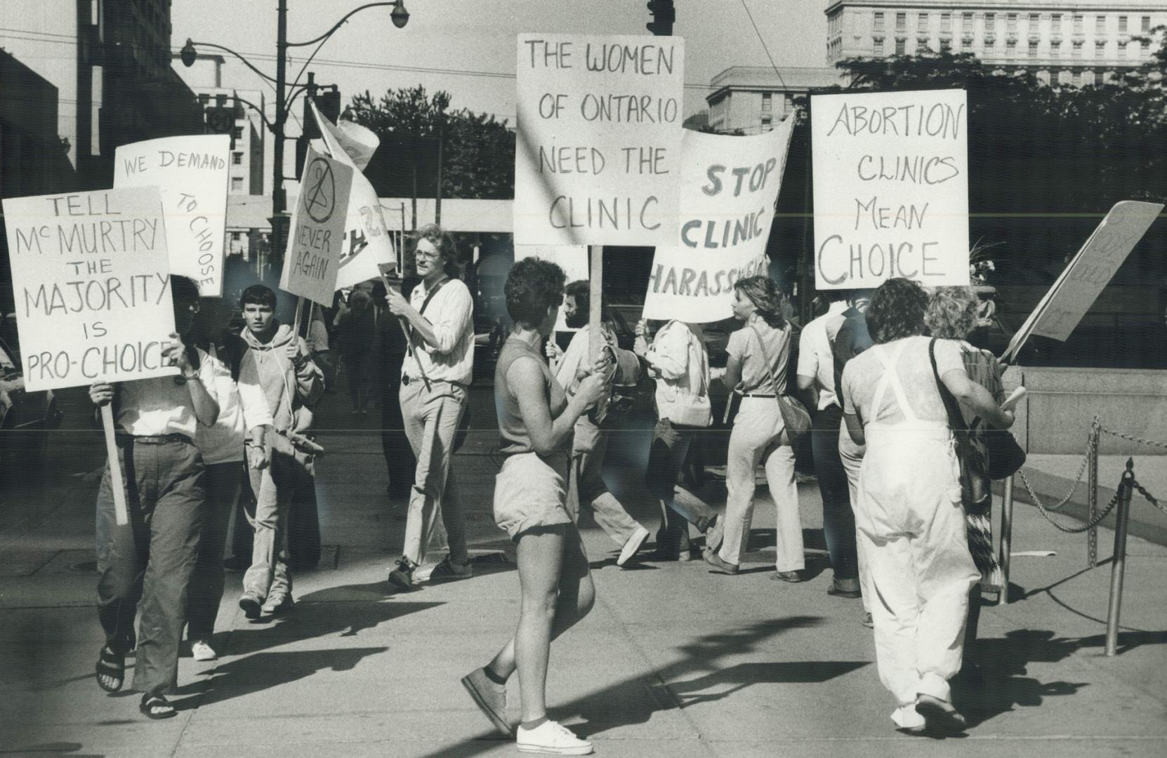 Clinic protest: Dr. Robert Scott is led by a police detective from Dr. Henry Morgentaler's abortion clinic yesterday. Scott, who spent the night in ja(...)