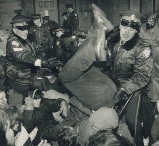 Pro-life demonstrators clash with police at a Gerrard St