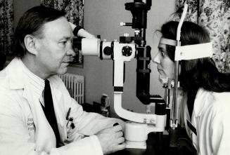 Medical progress: Dr. Clive Mortimer demonstrates the scanner with the help of nurse Katherine Thomas. The scanner may be a big aid in diagnosis