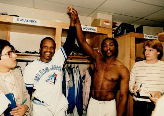 Lloyd Moseby, right, and Al Oliver celebrate