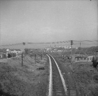 Looking northwest up C.P.R. tracks from temporary Rogers Road bridge over tracks. Toronto, Ontario