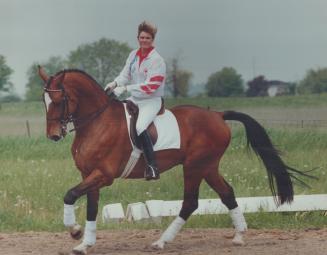 A winning combination. Ashley (Nicoll) Munroe won a bronze medal aboard Reipo in dressage at last September's Seoul Olympics but she's not resting on (...)