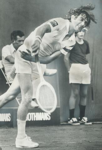 Take that! Ilie Nastase, hair flying, is the picture of concentration and perspiration as he delivers a first service but he apparently lacked inspira(...)