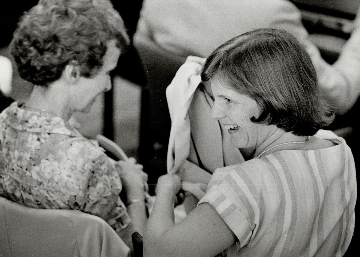 On the stand, Hospital for Sick Children nurse Susan Nelles talks to spectator at Grange commission inquiry yesterday before taking the stand. At left(...)