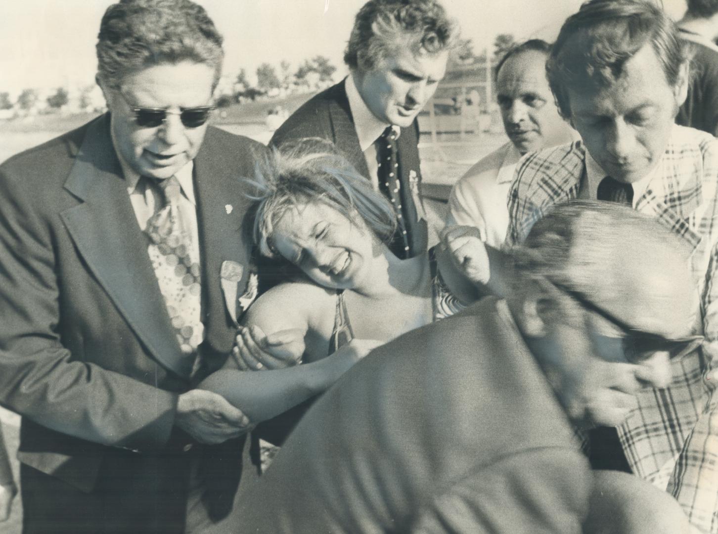 Cindy Nicholas, Marathon swimmer is helped ashore after swimming Lake Ontario