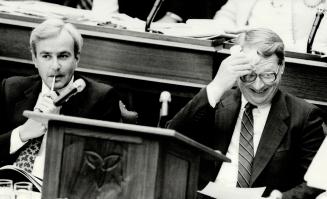 Opposition grilling, Treasurer Robert Nixon wipes the sweat from his brow and Premier David Peterson nibbles on a pencil as they wait for order to be (...)