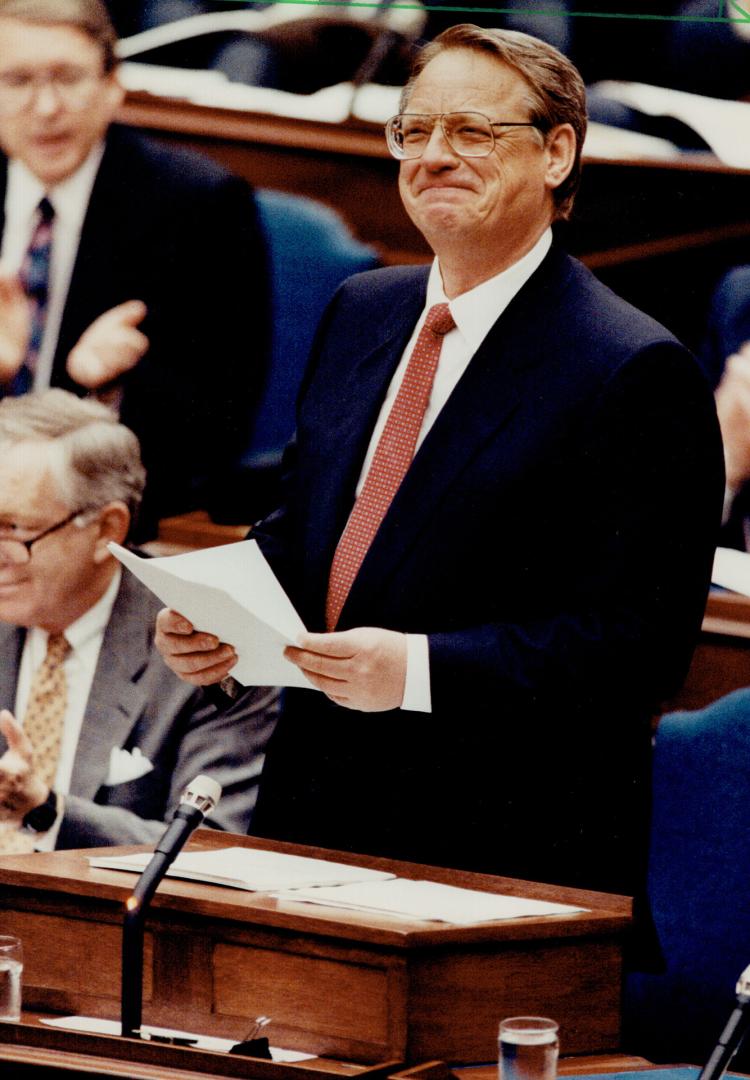 All smiles, Ontario Treasurer Bob Nixon puts on a happy face while delivering his budget in the Legislature yesterday