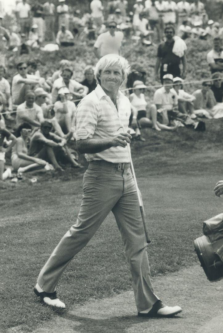 Beaming leader, Defending champion Greg Norman, the expatriate Australian who won the Canadian Open last year, was in a good mood after a 67 yesterday and a piece of the lead