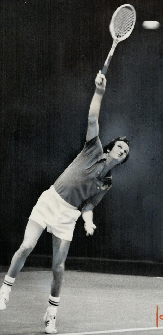 Two power hitters, Frew McMillan (left) of South Africa displays his overhead smash, while The Netherland's Tom Okker rockets a serve in yesterday's f(...)