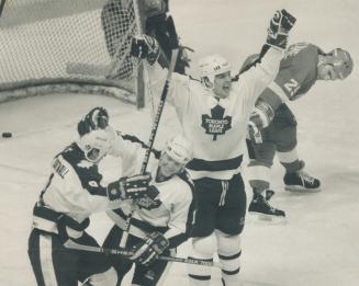 How sweet it is! Ed Olczyk of Maple Leafs waves his arms in joy Courtnall, shown at left celebrating with Gary Leeman, had potted the 5-4 goal against(...)