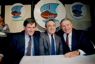 One happy gang, Carling O'Keefe's John Barnett, left, Harry Ornest and team president Ralph Sazio were all smiles at press conference yesterday annouc(...)