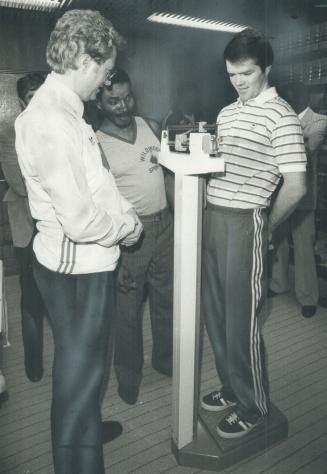 At the weigh-in, Toronto Mayor Art Eggleton looks intently at the scale as Toronto boxer Shawn O'Sullivan goes through the weigh-in ceremony yesterday(...)