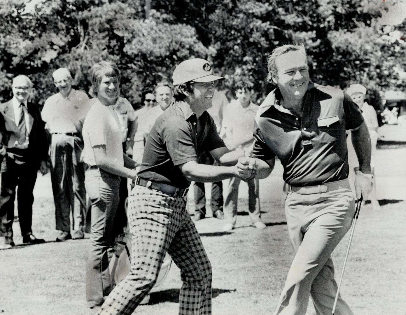 Hamming it up, Lee Trevino, left, and Arnold Palmer, enjoyed a little play yesterday at Mississaugua Golf Club during an exhibition round