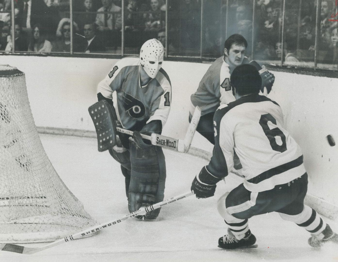 Flyer Goalie in a wandering mood, As effective behind his goal as he is in front, Philadelphia Flyers' goalie Bernie Parent flicks puck off boards pas(...)