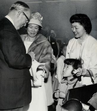 A proud moment came for Elaine Ogaki, 6, at Saturday's opening of the Japanese Cultural Centre in Don Mills when Prime Minister Pearson autographed a (...)