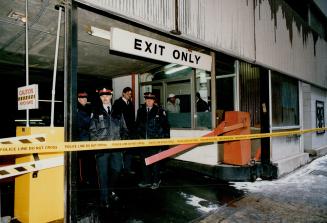 Murder scene, Police investigate the Toronto Parking garage where janitor Albert Philip, 63, was murdered yesterday by a man who later raped a St. Catherines woman, 21