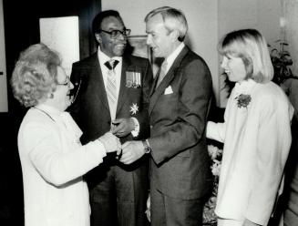 Proud moment, Ontario Premier David Peterson and his wife Shelley introduce Peterson's mother, Laura, to Lieutenant-Governor Lincoln Alexander after t(...)