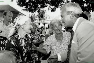 Campaign introduction, Premier David Peterson meets Stanistawa Grzby in Toronto yesterday on visit to new Bloor St