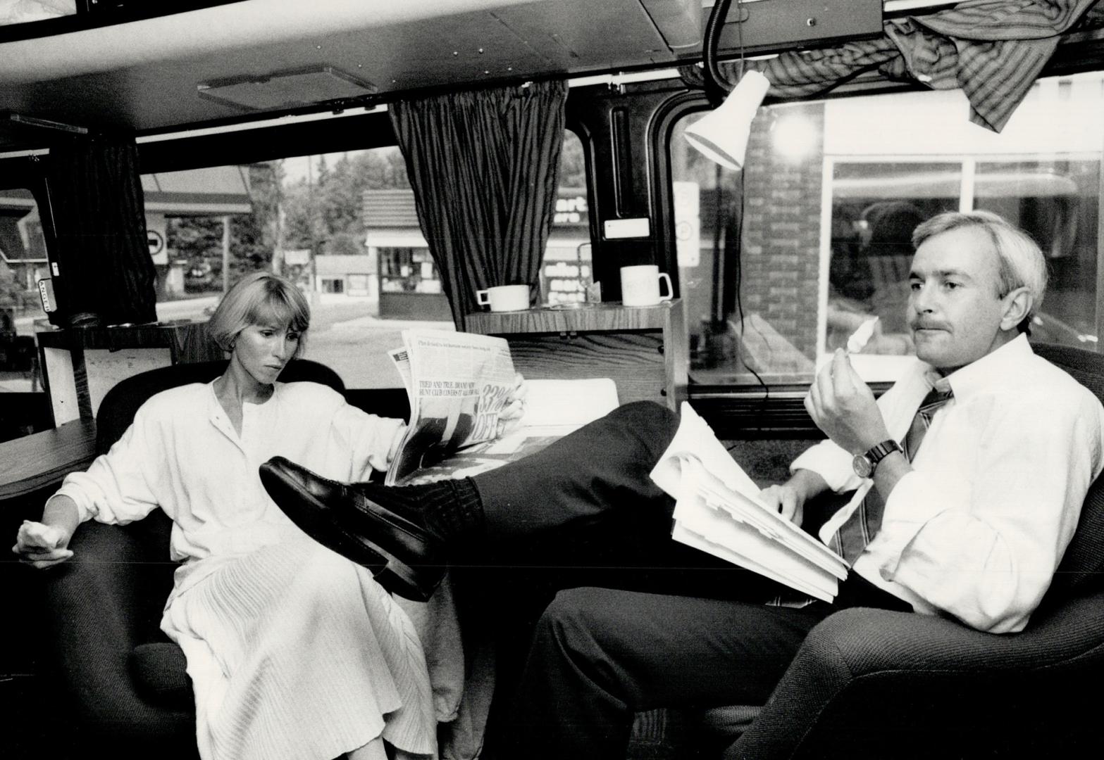 Time to unwind, Premier David Peterson and his wife, Shelley, share a quiet moment yesterday aboard the Liberals' bus during the campaign for Thursday(...)