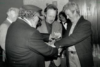 In a party mood, Filmmaker Harry Rasky and actors Eric Peterson and Gordon Pinsent enjoy themselves at Variety Club luncheon on Friday. Pinsent and Pe(...)