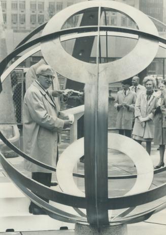 Ex-mayor gives a timely gift. Former Toronto mayor Nathan Phillips stands beside sundial he presented to the city yesterday in Nathan Phillips Square.(...)