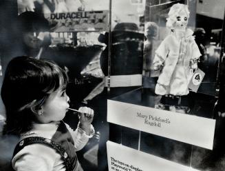 Dolly in the window, Lori Anne Dimatteo, 2, of Etobicoke, won't find this doll under the Christmas tree