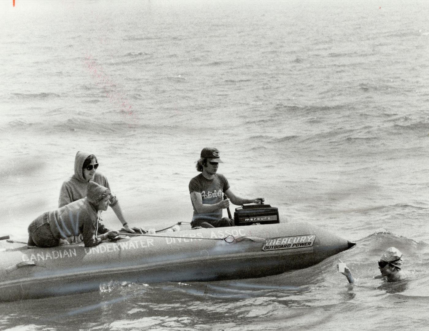 Elizabeth pauses for a moment to have a drink during her bid to swim Lake Ontario