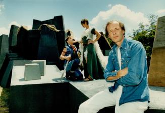 Designed chaos, Jim Plaxton perches in front of the post-holocaust set he's created for Skylight Theatre's Macbeth