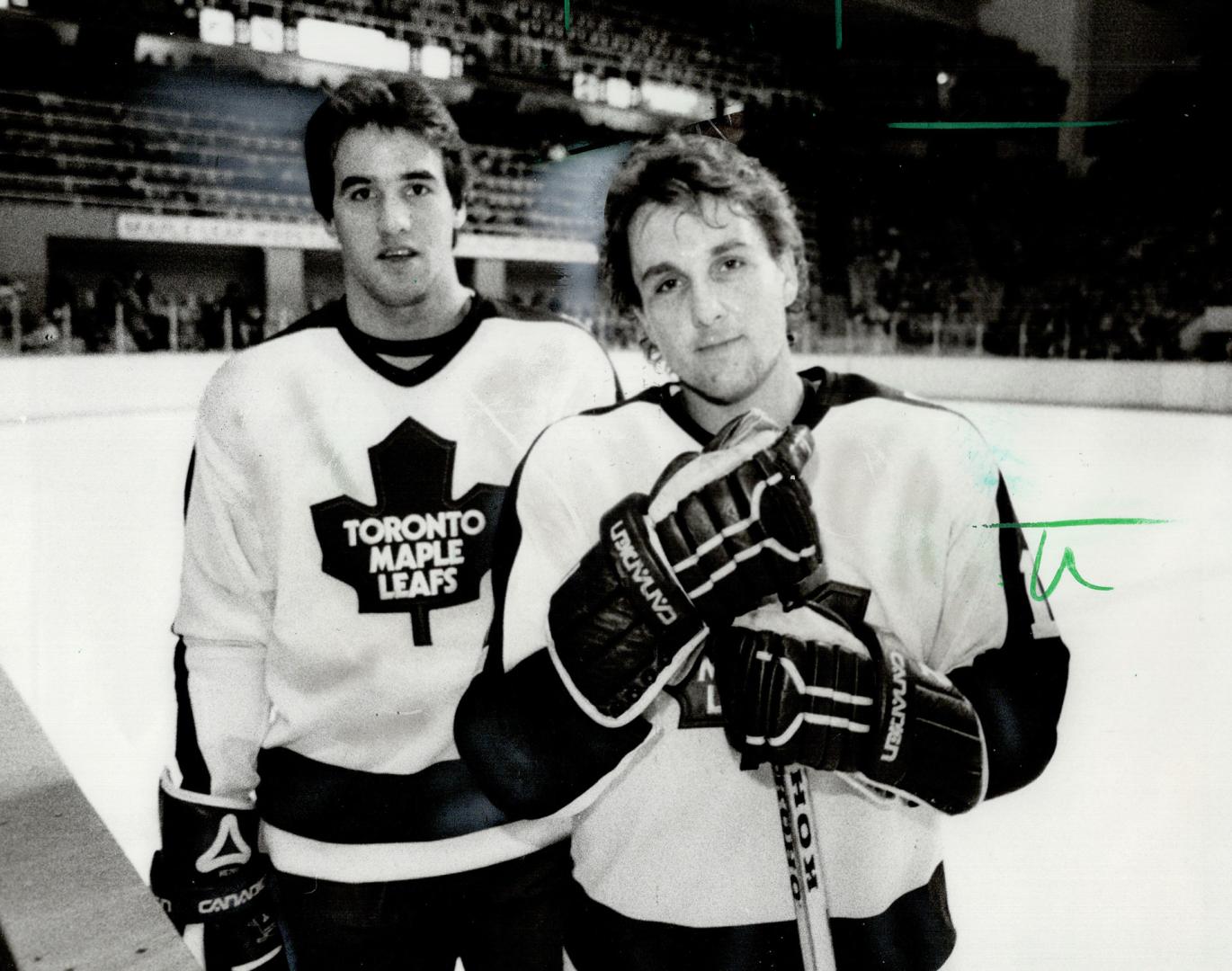 Budding Leafs, Defenceman Jim Korn (left), former Detroit Red Wing, and winger Walt Poddubny, from Edmonton via Wichita, got their baptism as new Leafs last night against the Hawks