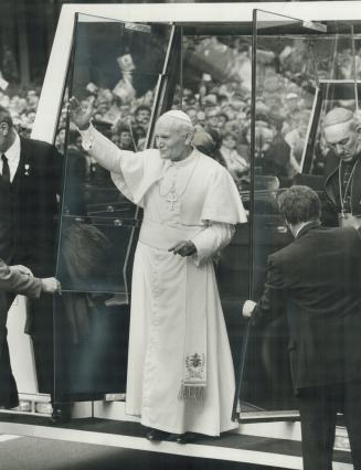 Welcome to Toronto, Thousands greet Pope John Paul II as he descends from his popemobile, followed by Emmett Cardinal Carter, outisde St. Paul's Angli(...)