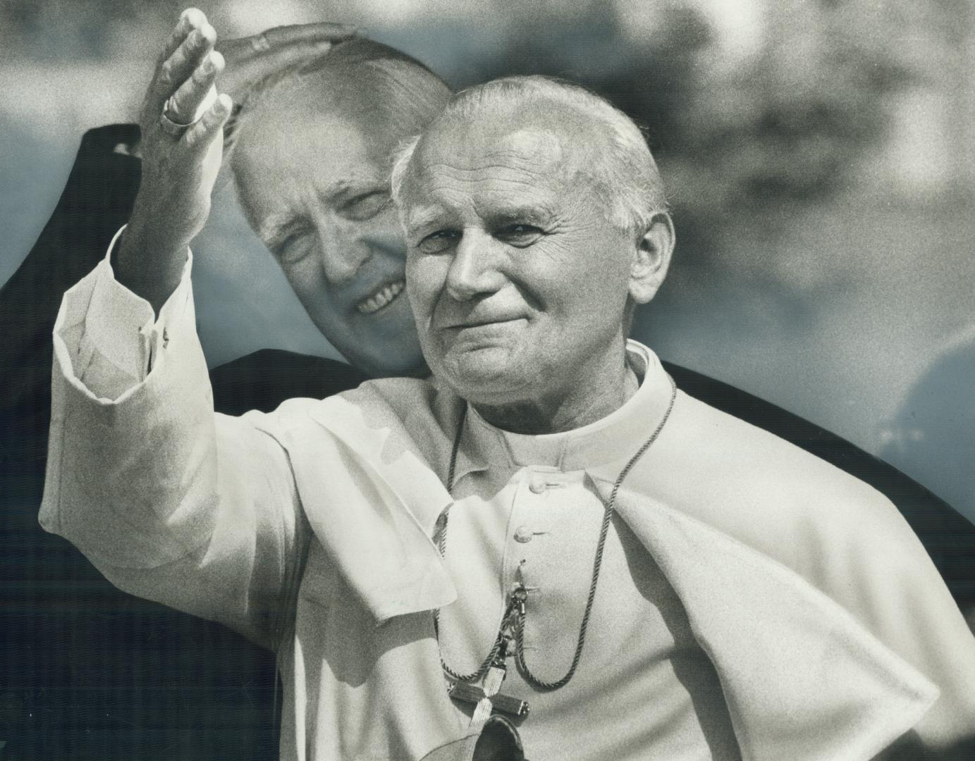 Greeting the people, The Pope, with Archbishop Louis-Albert Vachon, waves to crowds