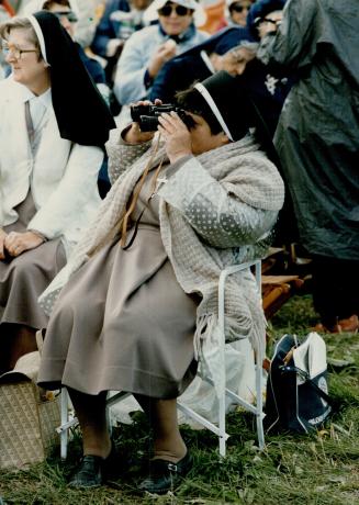 Papal peek, Not to be denied a close-up look of her church's leader, one nun brought a pair of binoculars to view the Mass spectacular, celebrated before more than 5000,000 people