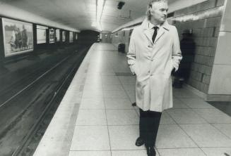 Boosting morale, Ready to reassure commuters about security on the subway, TTC chairman Julian Porter stands on the platform at the St. Clair station (...)