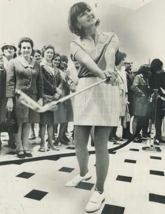 Golfer Sandra Post in Plaid skirt and T-shirt