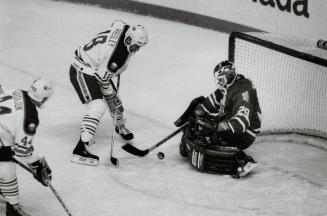 Sniper on the doorstep. Leafs goalie Felix Potvin crouches and appears to have all the angles covered on Buffalo sniper Wayne Presley. Potvin played s(...)