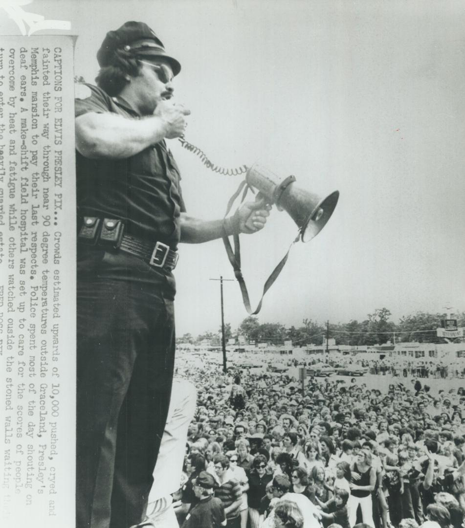 Crowds estimated upwards of 10,000 pushed, cryed and fainted their way through near 90 degree temperatures outside Graceland, Presley's Memphis mansion to pay their last respects